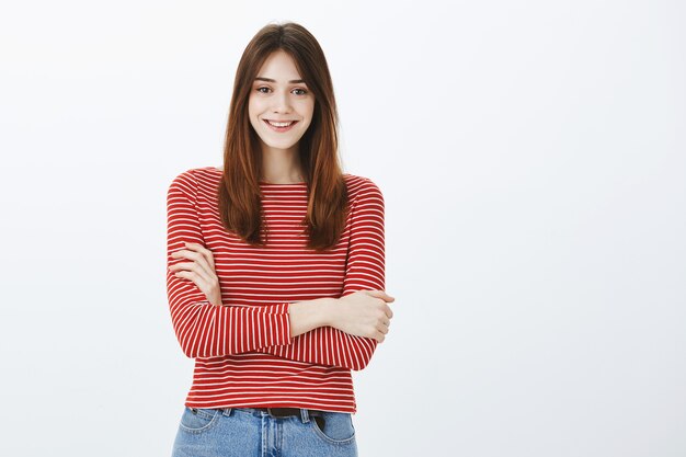 Studio shot of a brunette girl in casual outfit