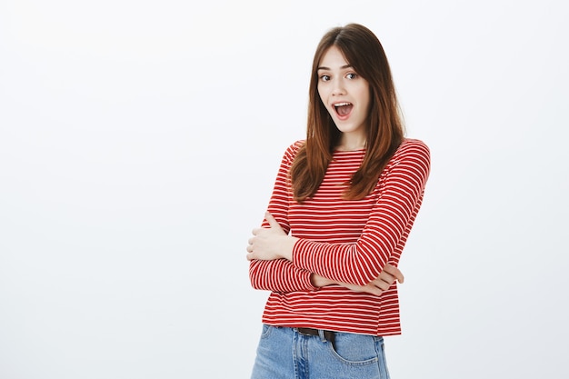 Studio shot of a brunette girl in casual outfit