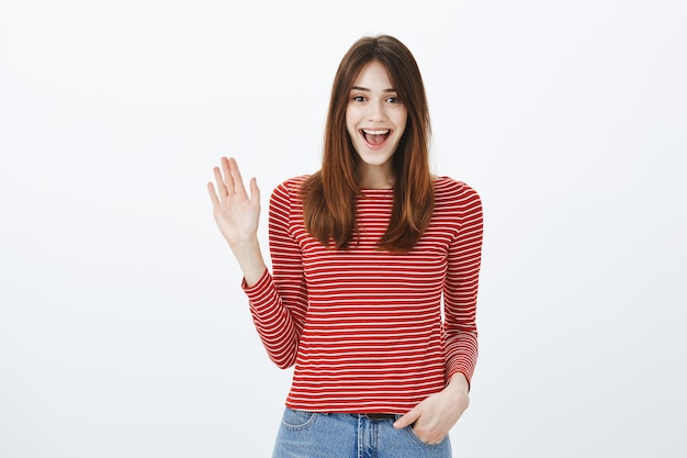 Studio shot of a brunette girl in casual outfit