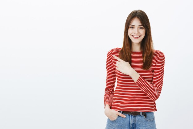 Studio shot of a brunette girl in casual outfit