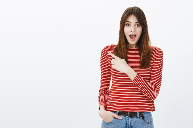 Studio shot of a brunette girl in casual outfit