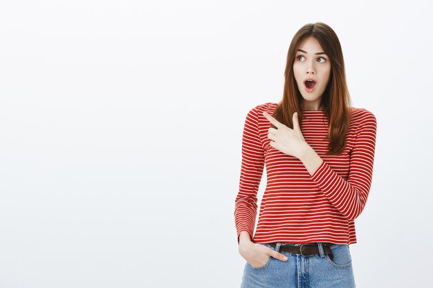 Studio shot of a brunette girl in casual outfit