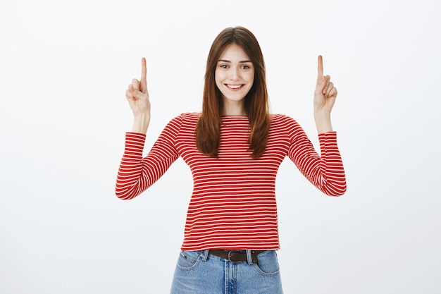 Studio shot of a brunette girl in casual outfit