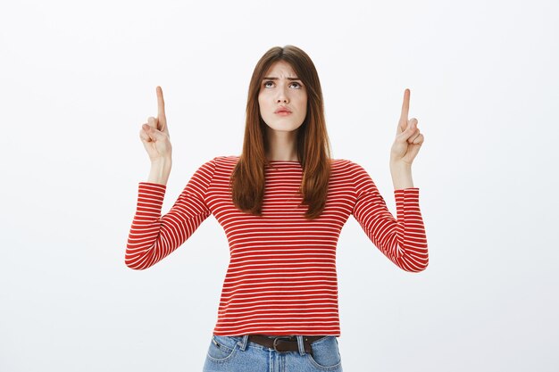 Studio shot of a brunette girl in casual outfit