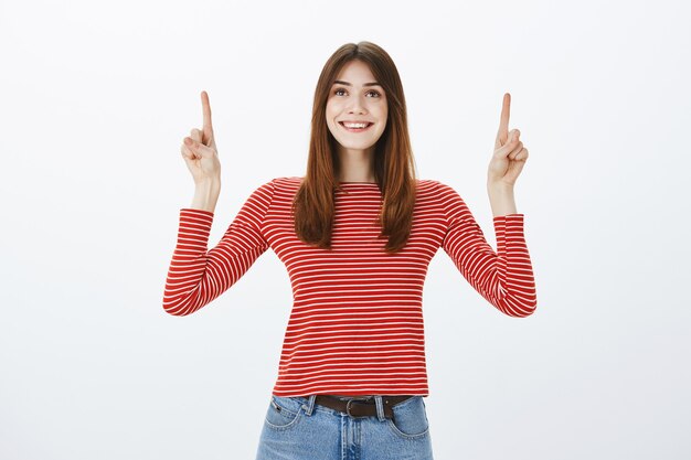 Studio shot of a brunette girl in casual outfit