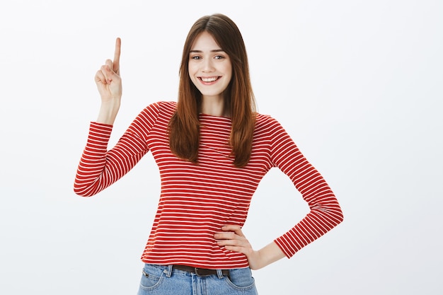 Studio shot of a brunette girl in casual outfit