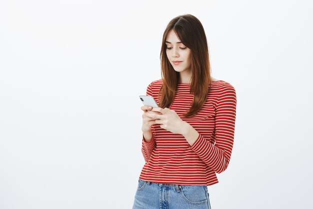 Studio shot of a brunette girl in casual outfit