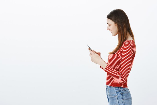 Studio shot of a brunette girl in casual outfit