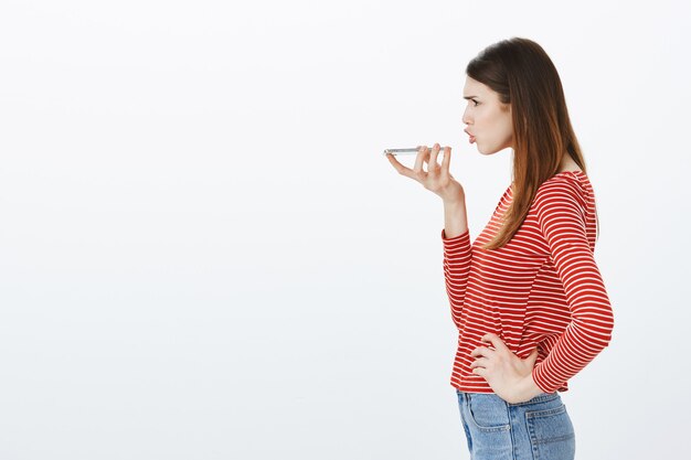 Studio shot of a brunette girl in casual outfit