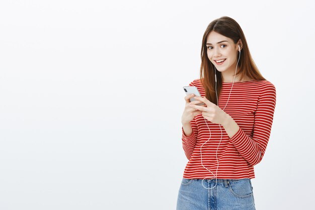 Studio shot of a brunette girl in casual outfit