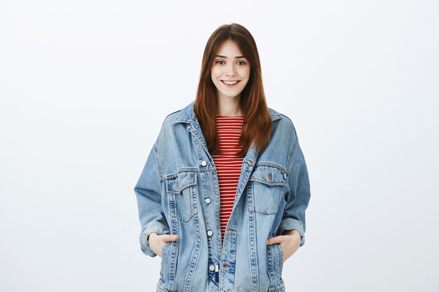 Studio shot of a brunette girl in casual outfit