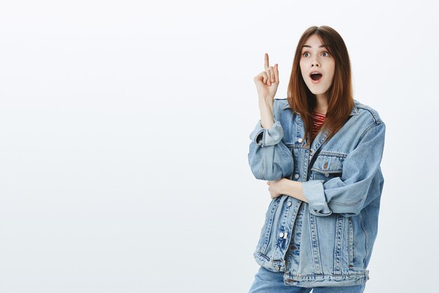 Studio shot of a brunette girl in casual outfit