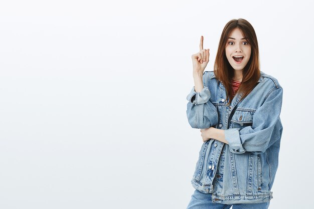 Studio shot of a brunette girl in casual outfit