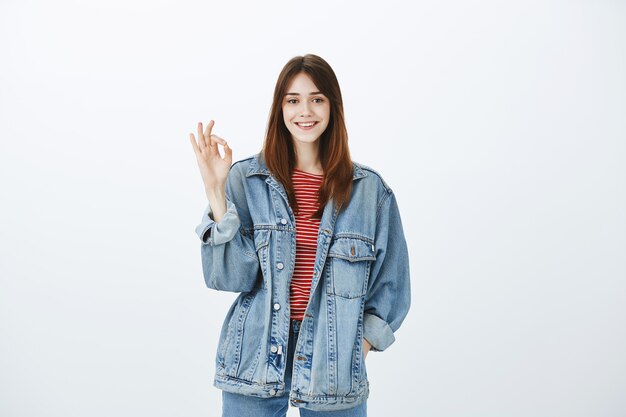 Studio shot of a brunette girl in casual outfit