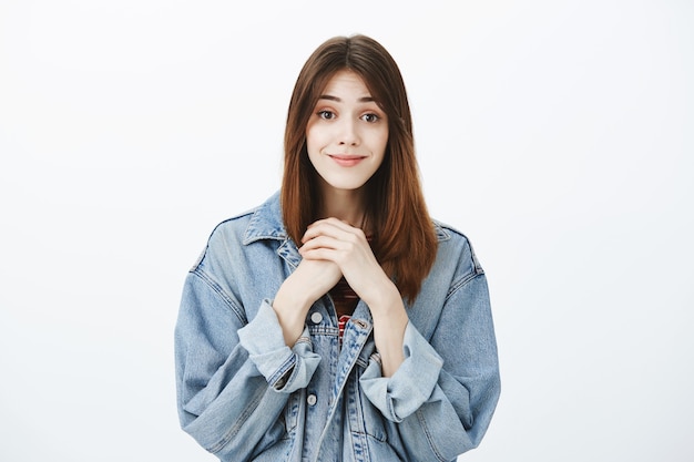 Studio shot of a brunette girl in casual outfit