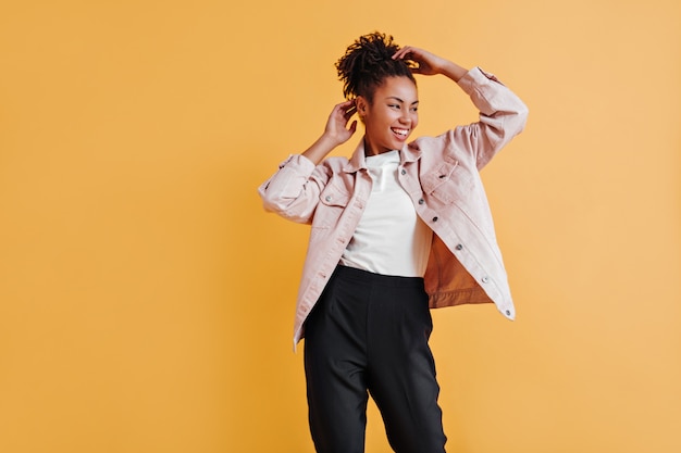 Studio shot of glamorous woman in jacket