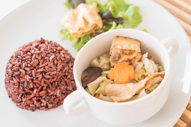 Stuffed cabbage soup with berry rice and tofu