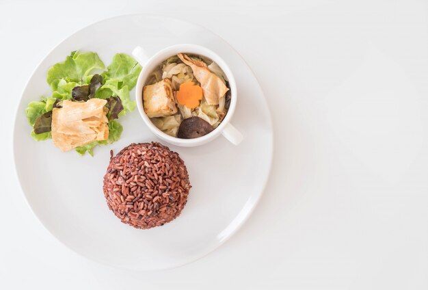 Stuffed cabbage soup with berry rice and tofu