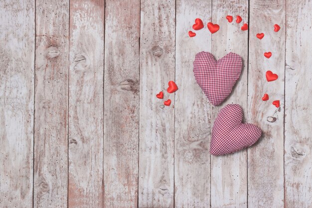 Stuffed hearts on a wooden table