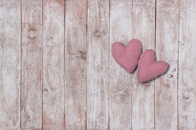 Stuffed hearts on a wooden table
