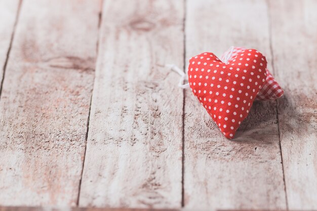 Stuffed hearts on a wooden table