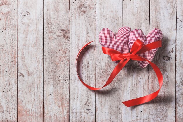 Stuffed hearts on a wooden table