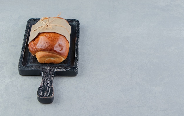 Stuffed tasty pastry on black board. 