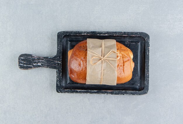 Stuffed tasty pastry on black board.