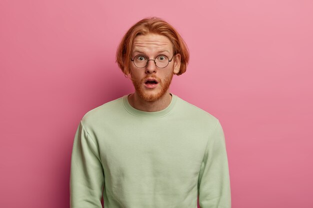 Stunned male with red hair and thick beard