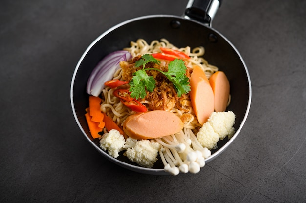 The style still life with noodles in the pan.