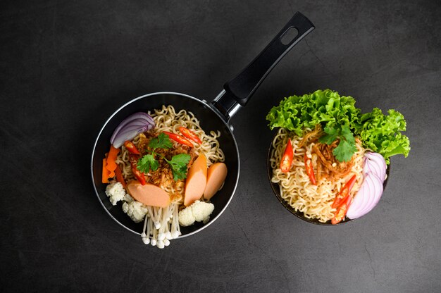 The style still life with noodles in the pan.