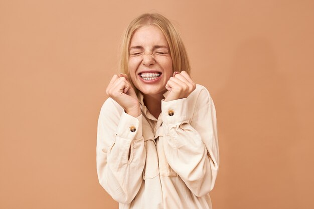 Stylish adorable student girl celebrating success