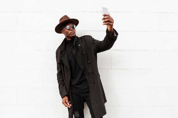 Stylish adult male taking a selfie