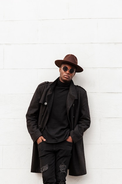 Stylish adult male with hat and sunglasses