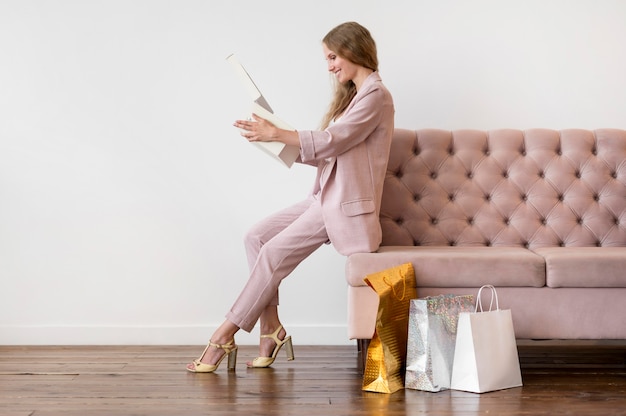 Free photo stylish adult woman checking purchases