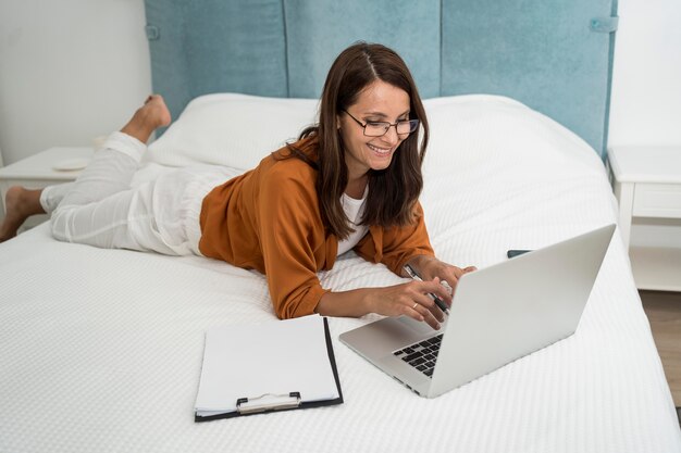 Stylish adult woman enjoying working at home