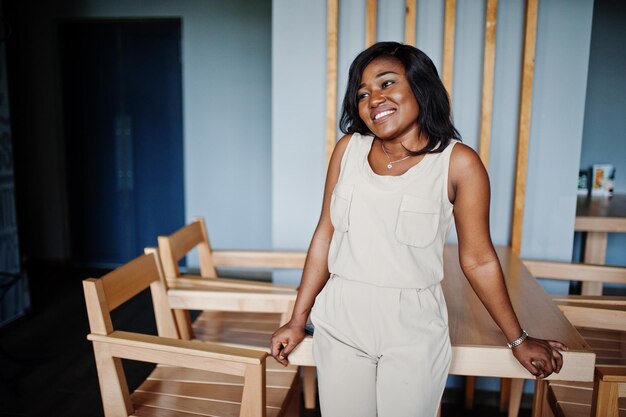 Stylish african american girl posed at modern cafe