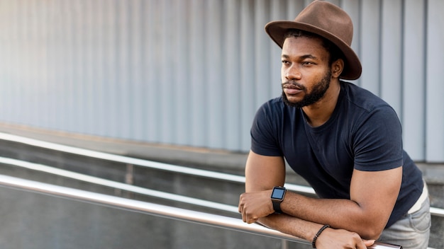 Stylish african american man looking away with copy space