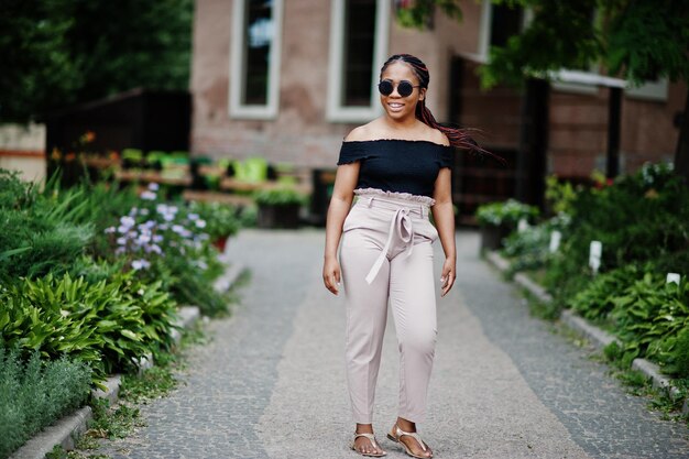 Stylish african american woman at sunglasses posed outdoor