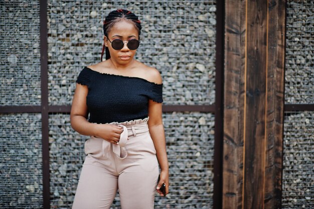 Stylish african american woman at sunglasses posed outdoor