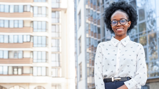 Stylish african woman in office clothes with copy space