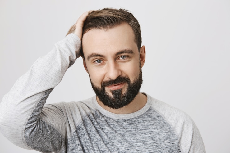 Free Photo stylish bearded man likes new haircut