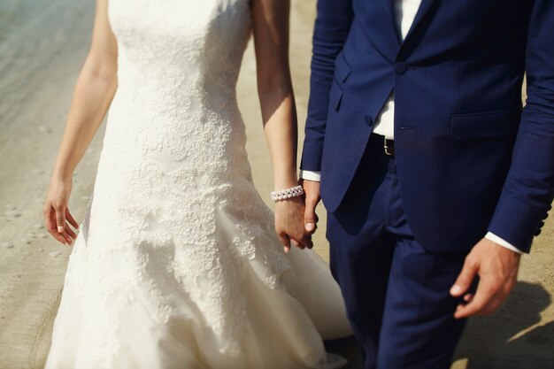 Stylish beautiful couple of happy newlyweds on a walk in San Diego on their wedding day