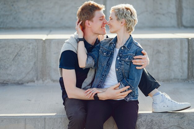 stylish and beautiful woman with short light hair, dressed in a blue jeans jacket 