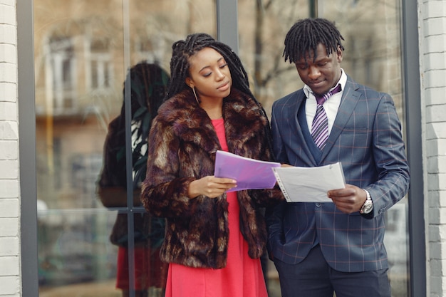 Stylish black couple have business conversation
