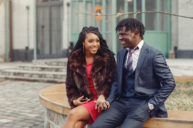 Stylish black couple spending time in a spring city
