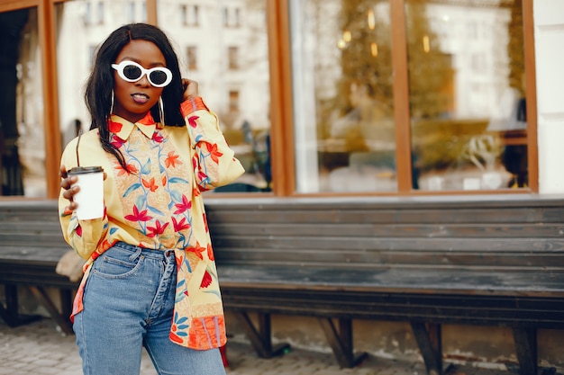 Free photo stylish black girl in a city