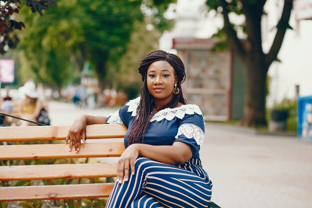 Stylish black girl in a park