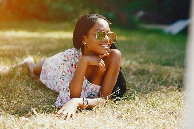 Stylish black girl in a park