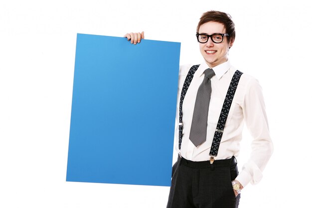 Stylish businessman with empty billboard